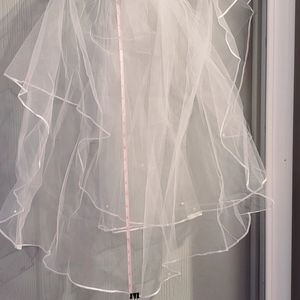 Wedding veil with pearl accents.
